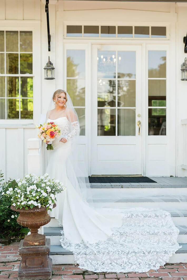 Bride standing outside in a wedding dress